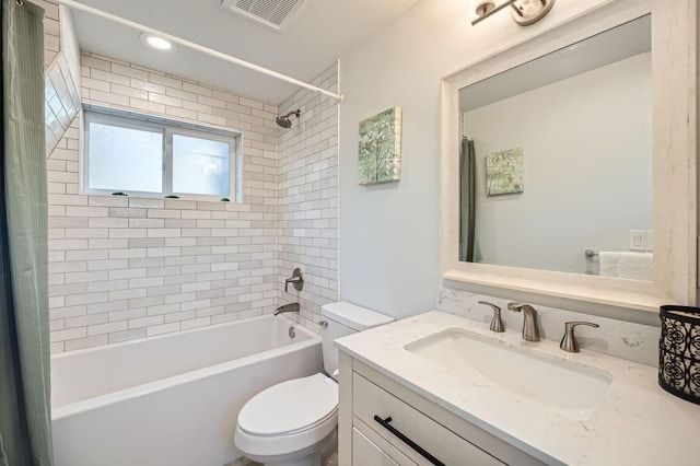 bathroom with visible vents, toilet, shower / bath combo with shower curtain, and vanity