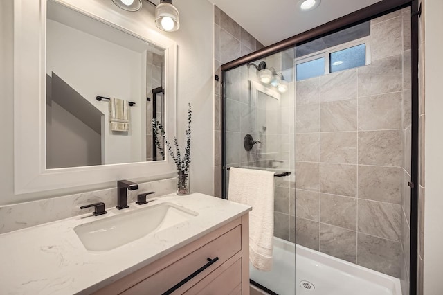 full bathroom featuring vanity and a stall shower