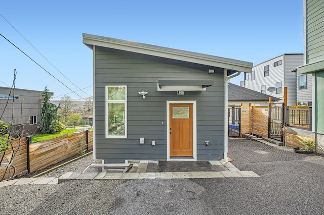 view of front of house with fence and a gate