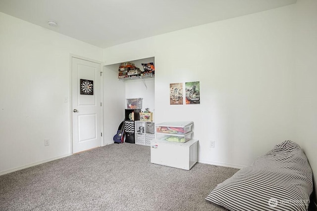 game room featuring baseboards and carpet