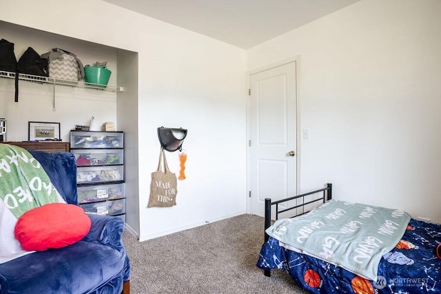 carpeted bedroom with baseboards