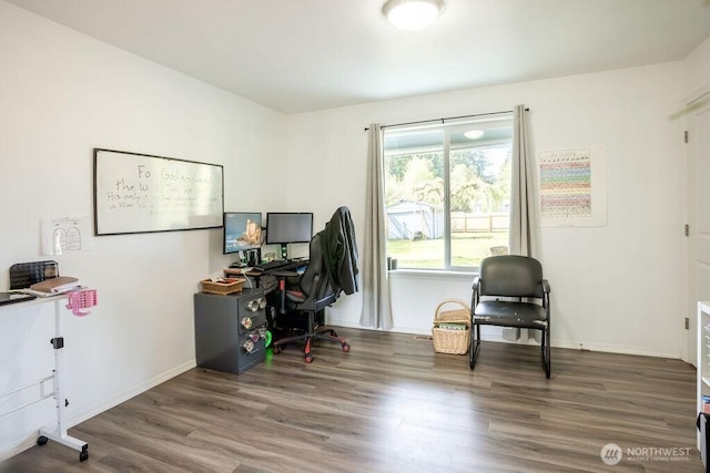 home office featuring baseboards and wood finished floors