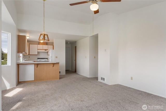 730 SE 8th Ave Unit G202, Oak Harbor, WA 98277 - unfurnished living room with light carpet, a ceiling fan, and visible vents