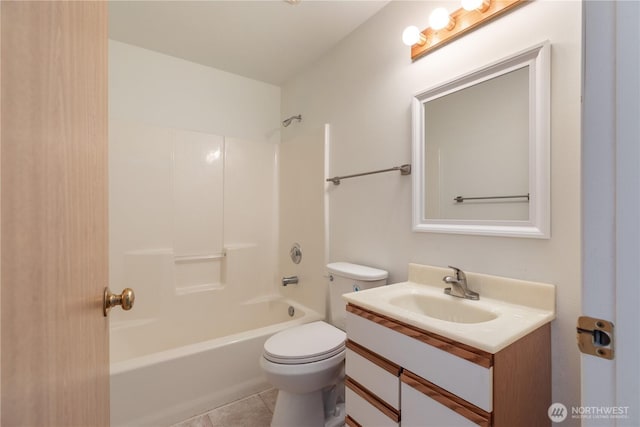 730 SE 8th Ave Unit G202, Oak Harbor, WA 98277 - full bathroom featuring washtub / shower combination, vanity, toilet, and tile patterned flooring
