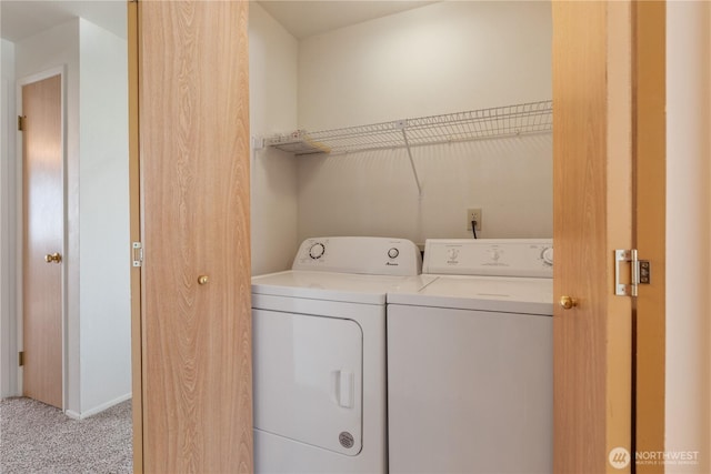 730 SE 8th Ave Unit G202, Oak Harbor, WA 98277 - laundry area featuring light carpet, washer and dryer, and laundry area