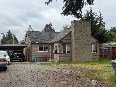 6148 88th St SW, Lakewood, WA 98499 - view of front facade featuring a chimney