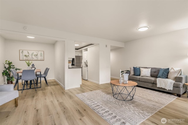 13730 15th Ave NE Unit F-103, Seattle, WA 98125 - living room featuring light wood finished floors, baseboards, and recessed lighting