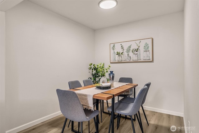 13730 15th Ave NE Unit F-103, Seattle, WA 98125 - dining room with wood finished floors and baseboards