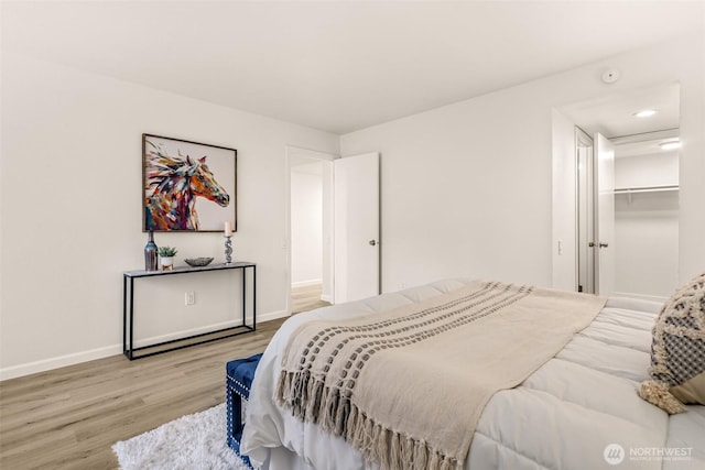 13730 15th Ave NE Unit F-103, Seattle, WA 98125 - bedroom featuring wood finished floors, baseboards, and recessed lighting