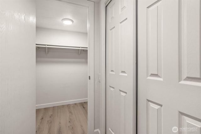 13730 15th Ave NE Unit F-103, Seattle, WA 98125 - spacious closet featuring wood finished floors