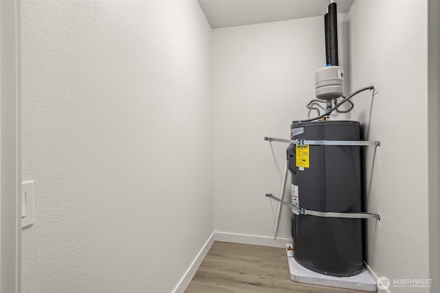 13730 15th Ave NE Unit F-103, Seattle, WA 98125 - utility room featuring strapped water heater