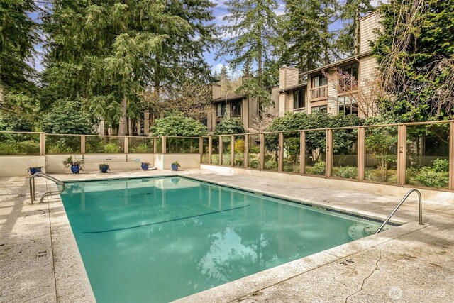 13730 15th Ave NE Unit F-103, Seattle, WA 98125 - view of pool with fence and a patio