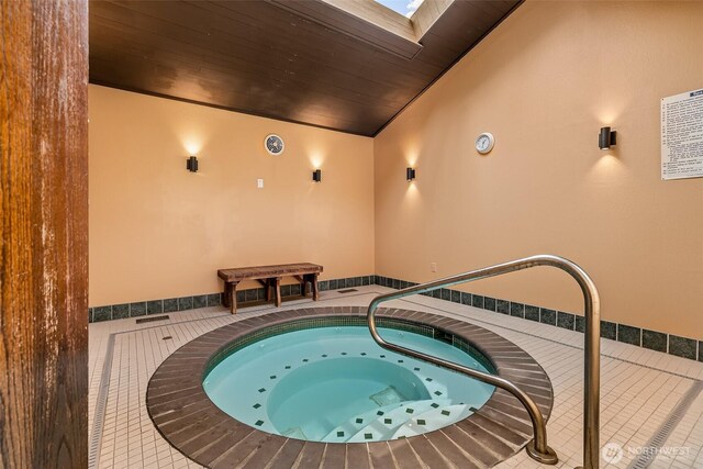 13730 15th Ave NE Unit F-103, Seattle, WA 98125 - view of swimming pool with a hot tub and a skylight