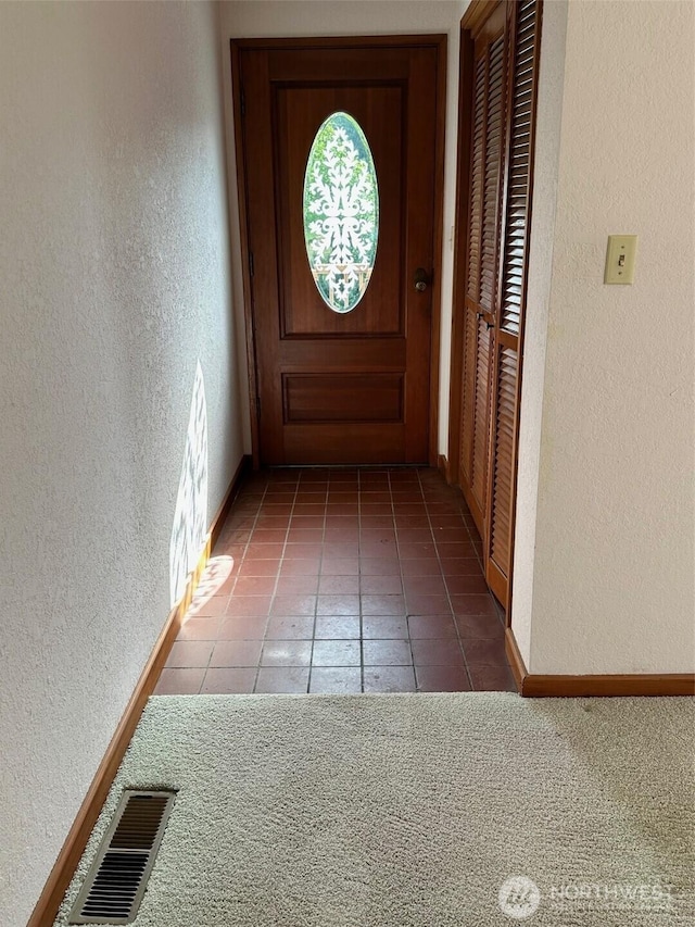 6255 Turkey Hill Rd, Clinton, WA 98236 - doorway featuring a textured wall, baseboards, and tile patterned floors