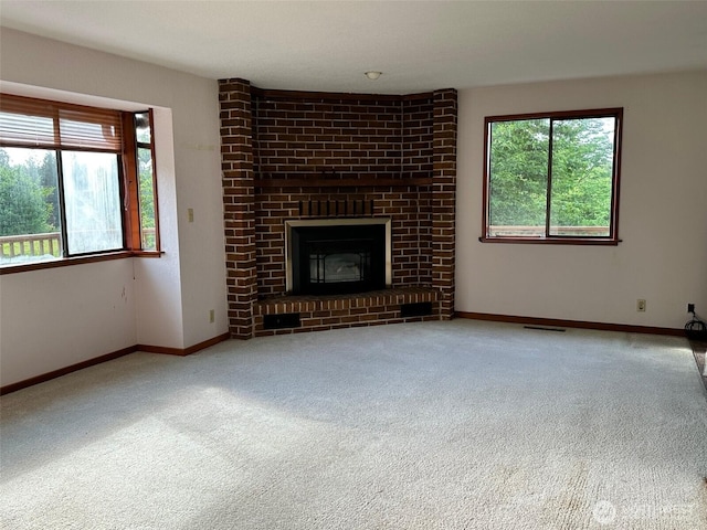 6255 Turkey Hill Rd, Clinton, WA 98236 - unfurnished living room with carpet flooring, healthy amount of natural light, a fireplace, and baseboards