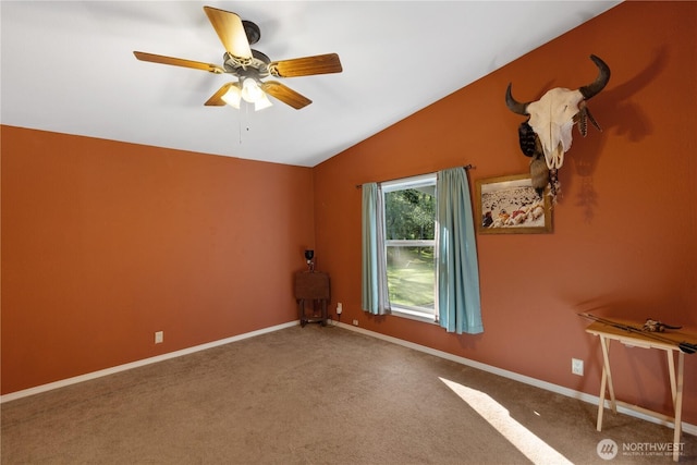 carpeted spare room with baseboards, a ceiling fan, and lofted ceiling