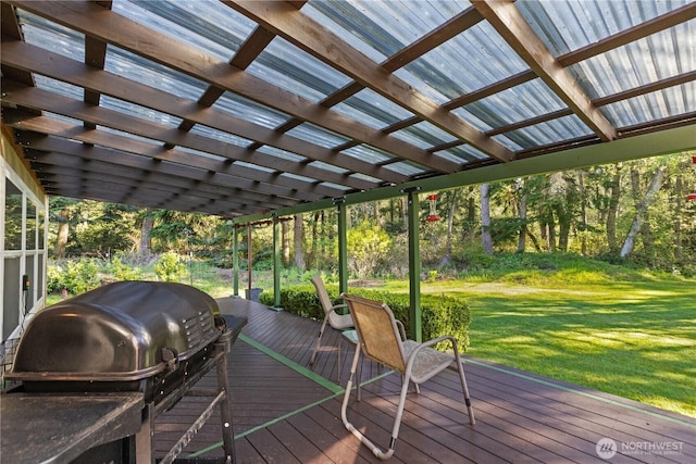 deck featuring a lawn and area for grilling