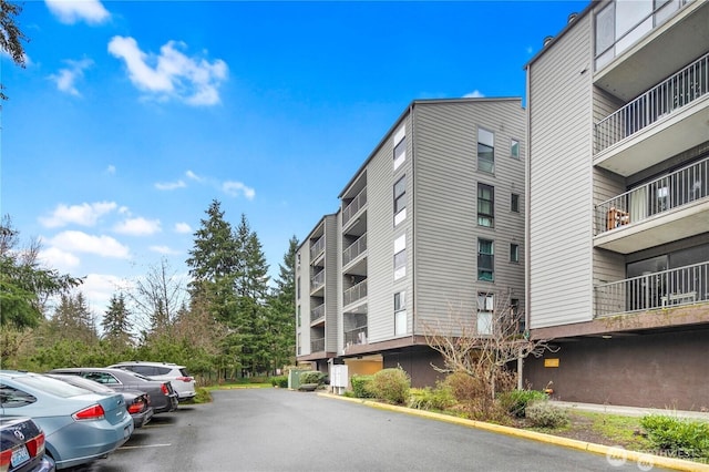view of property with uncovered parking