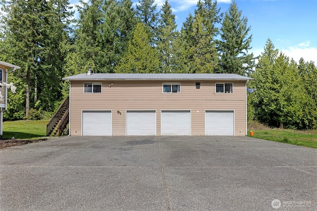 5675 Winona Ln, Langley, WA 98260 - garage featuring driveway and a detached garage