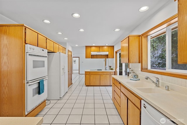 5675 Winona Ln, Langley, WA 98260 - kitchen with light tile patterned floors, a sink, white appliances, recessed lighting, and decorative backsplash