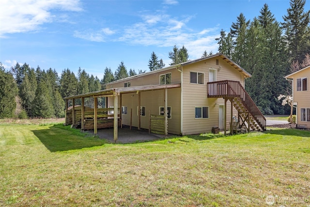 5675 Winona Ln, Langley, WA 98260 - rear view of property with a lawn, stairs, and a deck
