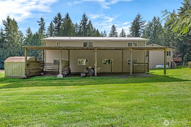 5675 Winona Ln, Langley, WA 98260 - back of house with a yard, an outbuilding, and metal roof