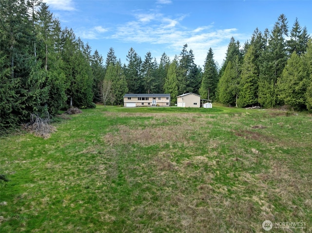 5675 Winona Ln, Langley, WA 98260 - view of yard featuring a wooded view