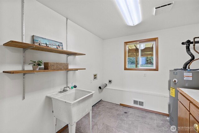 5675 Winona Ln, Langley, WA 98260 - clothes washing area featuring visible vents, hookup for a washing machine, electric dryer hookup, and laundry area