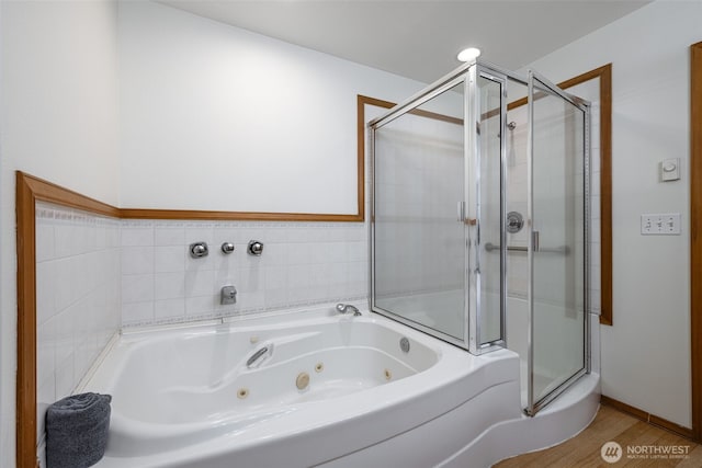 5675 Winona Ln, Langley, WA 98260 - bathroom featuring a whirlpool tub, a shower stall, and wood finished floors