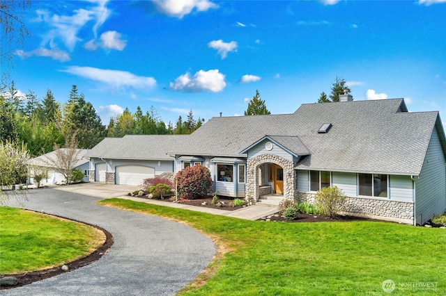 view of front of house featuring aphalt driveway, a front yard, stone siding, and a chimney