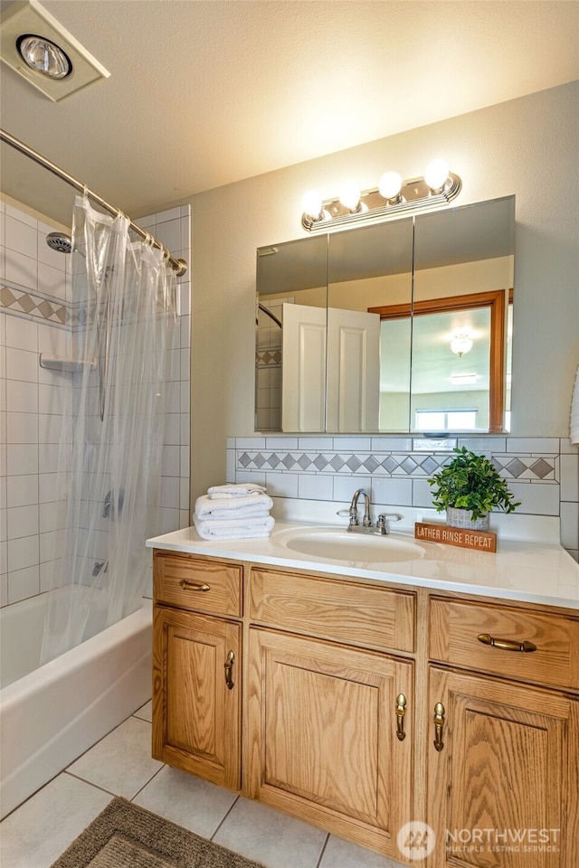 bathroom featuring tasteful backsplash, shower / tub combo, vanity, and tile patterned flooring