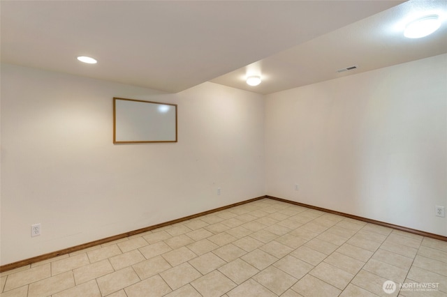 finished basement featuring recessed lighting, visible vents, and baseboards