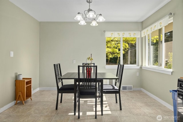 19529 Locust Way, Lynnwood, WA 98036 - dining area with a chandelier, light tile patterned flooring, and baseboards
