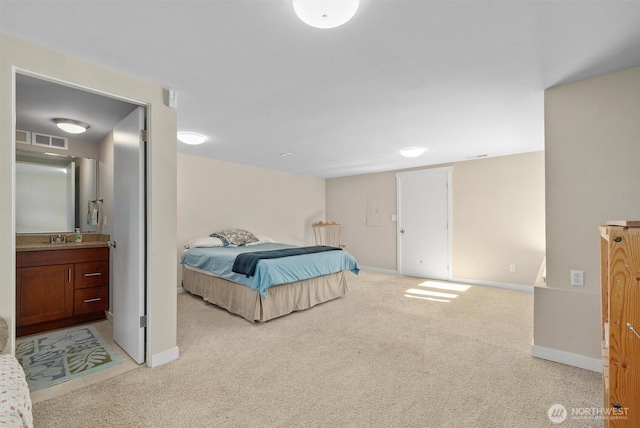 19529 Locust Way, Lynnwood, WA 98036 - bedroom with light carpet, a sink, baseboards, and connected bathroom