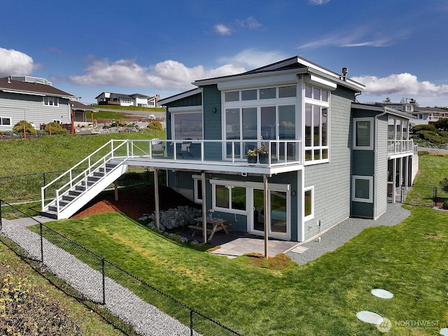 rear view of house with a fenced backyard, a patio area, stairs, a deck, and a yard