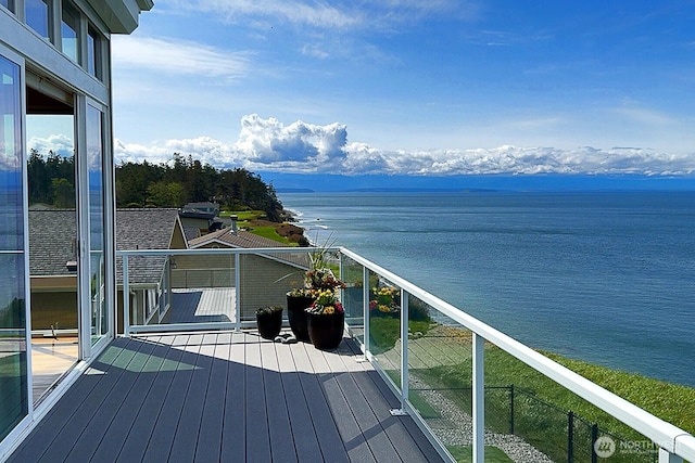 balcony featuring a water view