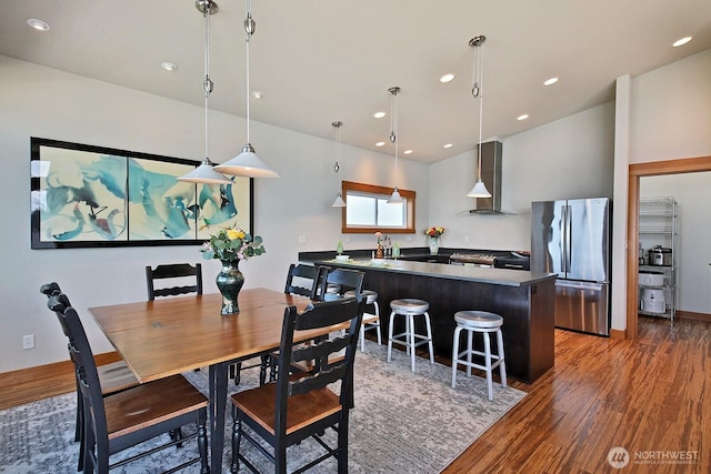 dining space featuring recessed lighting and wood finished floors