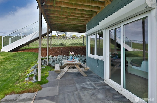 view of patio featuring fence