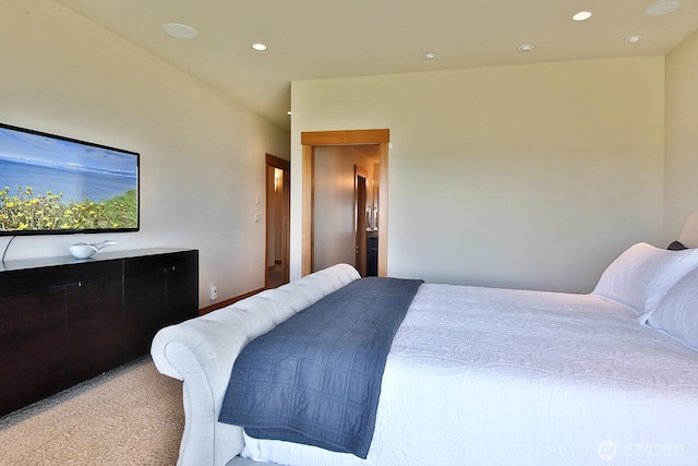 bedroom with light carpet and recessed lighting