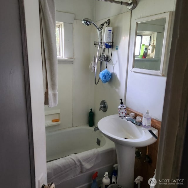 full bathroom featuring shower / tub combination and a healthy amount of sunlight