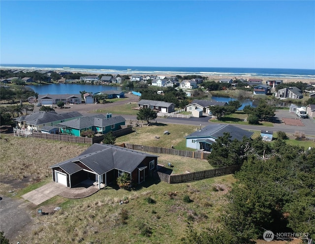birds eye view of property featuring a residential view and a water view