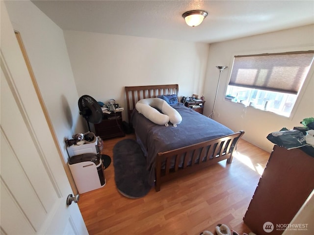 bedroom featuring wood finished floors