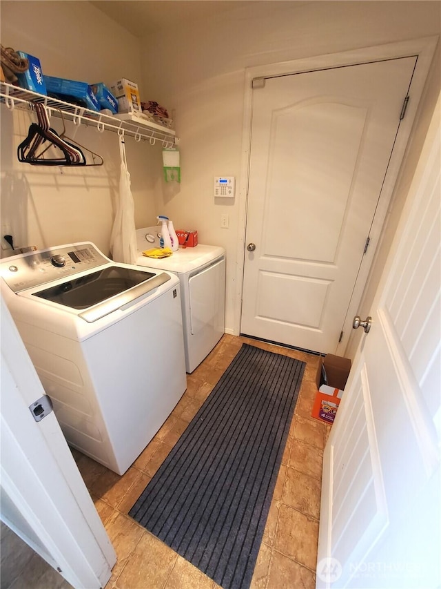 laundry area featuring washer and dryer and laundry area