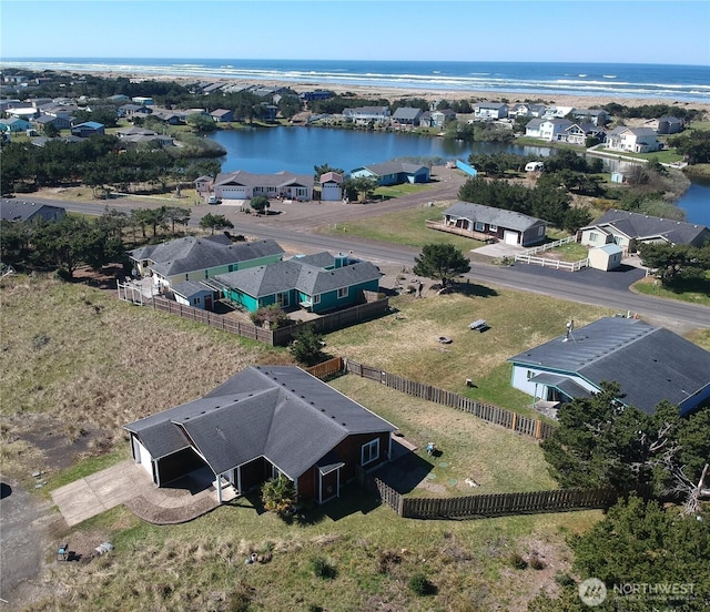 bird's eye view featuring a residential view and a water view