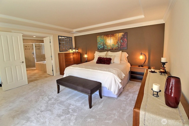 bedroom with carpet, crown molding, and ensuite bath
