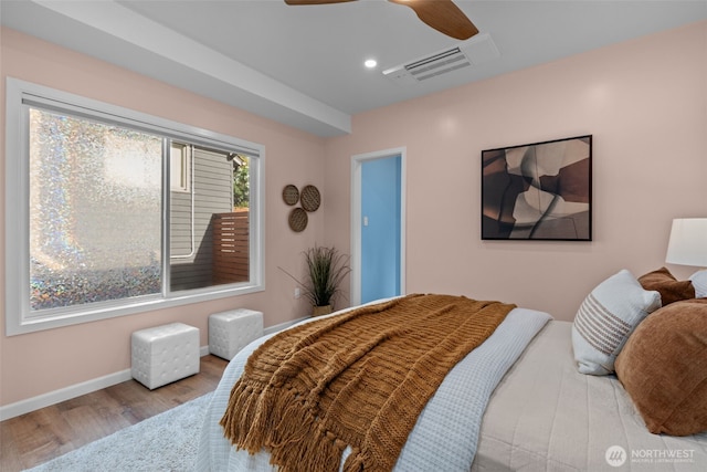 bedroom with ceiling fan, recessed lighting, baseboards, wood finished floors, and visible vents