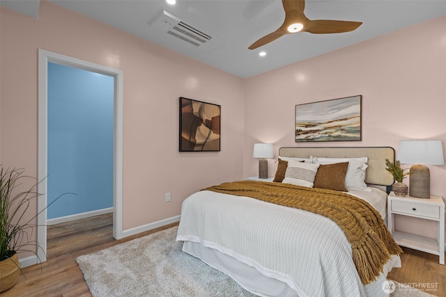 bedroom featuring visible vents, wood finished floors, baseboards, ceiling fan, and recessed lighting