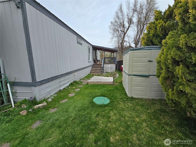 view of yard featuring a storage shed and an outbuilding