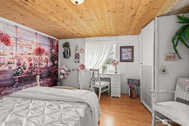 bedroom with wood finished floors and wood ceiling