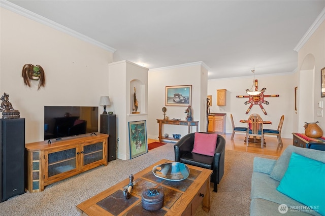 living area featuring baseboards and ornamental molding
